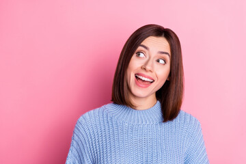 Portrait of attractive amazed curious cheery girly brown-haired girl looking aside copy space isolated over pink pastel color background