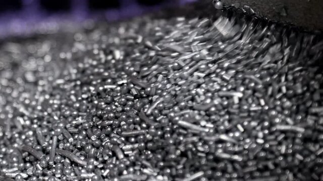 Pellets falling at the end of a production line