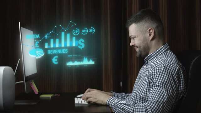 Man working with corporate data at home in dark room on desktop computer