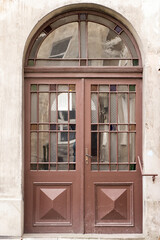 The vintage design brown  wooden front door of an old house