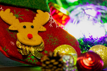 Closeup of Christmas stocking with ornaments and lights. Merry Christmas concept