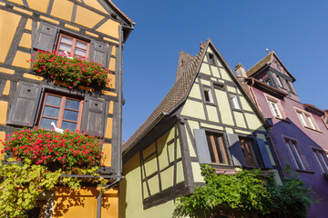 Fototapeta na wymiar Facade of half timbered houses in Riquewihr village, France