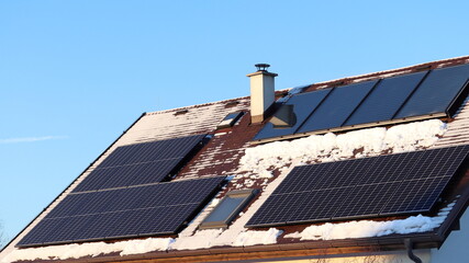 Photovoltaic panels vs. thermal solar panels. Energy production on the roof of the house....