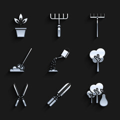 Set Watering can with water, Gardening handmade scissors for trimming, Tree pears, Shovel the ground, rake and Flowers pot icon. Vector