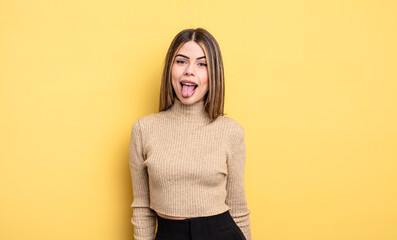 pretty caucasian woman with cheerful, carefree, rebellious attitude, joking and sticking tongue...
