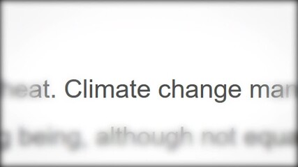 CLOSE-UP: Breaking news about climate change. Macro shot of rapidly changing headlines of articles in the media about the problem of global warming. Concept of environmental protection.