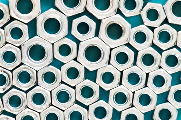 Bolts and nuts background, stainless metallic equipment