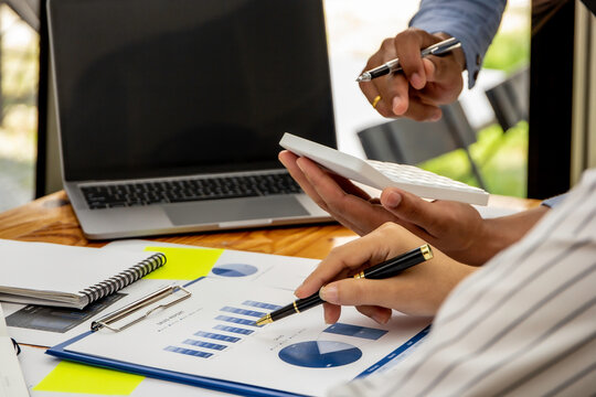 A salesperson stands to discuss last month's sales with a sales manager, a financial advisor analyzing data with investors, business ideas working with a team of colleagues and marketing planners.