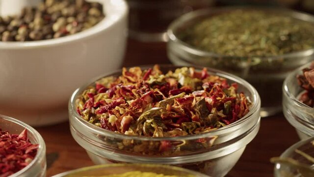 Various spices in glass bowls close-up. Middle eastern and arabian culture. Seasoning and flavors. Pepper, coriander, cinnamon, turmeric, paprika, bay leaf, star anise. Dry herbs for cooking. 