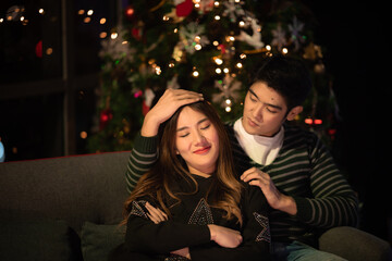 young Asian couple in night celebration with romantic love together, happy holiday Christmas party