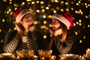 young Asian couple in night celebration with romantic love together, happy holiday Christmas party