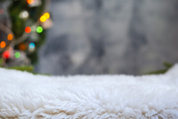 Christmas background of de-focused lights with decorated tree,  fur, copy space, selective focus 