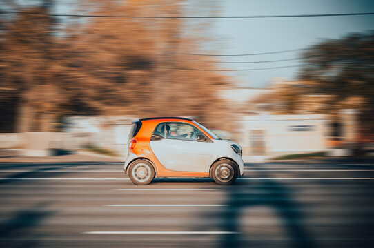 Smart Fortwo W453 Third generation Microcar manufactured by German multinational Daimler AG. City car moving on street at high speed