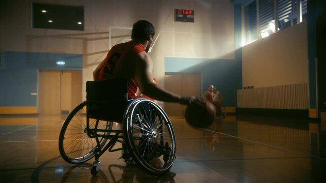 Wheelchair Basketball Game Court: Paraplegic Professional Players Competing, Passing, Shooting Ball. Determination, Inspiration, and Skill of a People with Disability. Slow Motion