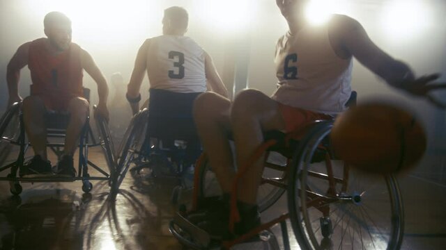 Wheelchair Basketball Game Court Winning Team Celebrate Victory, Cheer and High Five. Players Compete, Shoot, Score Goal Points. Determination, Skill of People with Disability. Slow Motion Shot