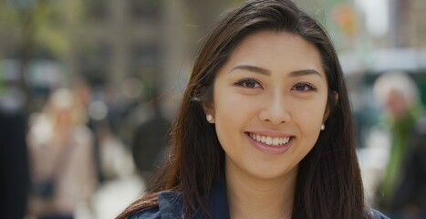 Young Asian woman in city face portrait