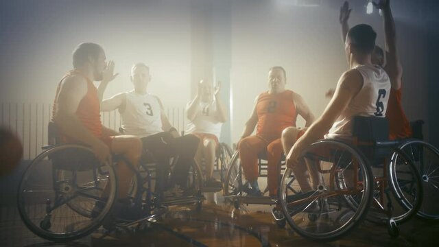 Wheelchair Basketball Game Court Winning Team Celebrate Victory, Cheer and High Five. Players Compete, Shoot, Score Goal Points. Determination, Skill of People with Disability. Handheld Dolly Shot