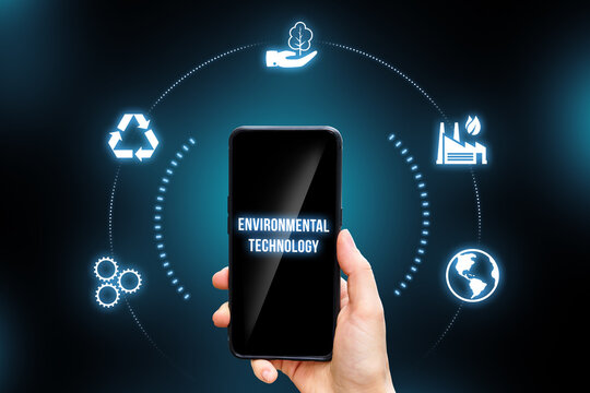 Concept of a hand holding a smartphone with environmental technology.