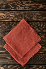 Two folded linen napkins on a wooden table with copy space, top - 474246283