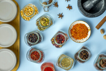 Set of spices isolated on light blue background