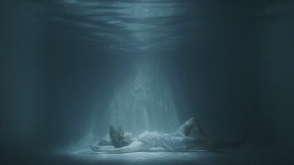 a girl in a white dress falls under the water