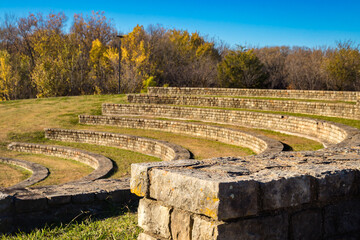 an amphitheater made of stones using grass for the seating area