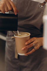 Barista Pouring Cream Into Coffee