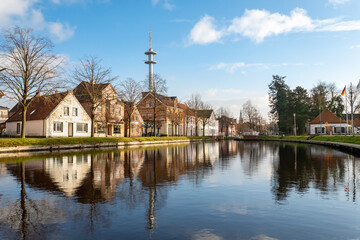 Reflection of houses in a width of the Papenburg canal