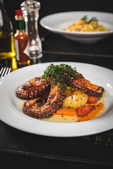 Perfect Seafood Menu Dish Plate Food Octopus Salmon, Shrimp Risotto Pasta Vegetables Salad Fish on a Dark Background