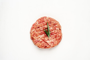 raw burger patty on white background
