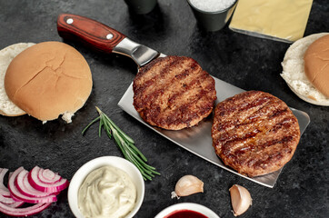 recipe for making a burger on a stone background