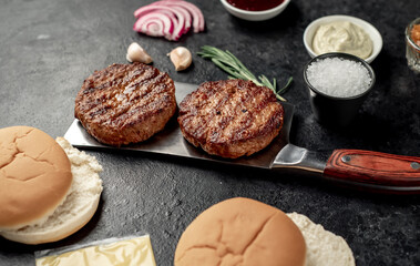 recipe for making a burger on a stone background
