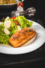 Perfect Seafood Menu Dish Plate Food Octopus Salmon, Shrimp Risotto Pasta Vegetables Salad Fish on a Dark Background