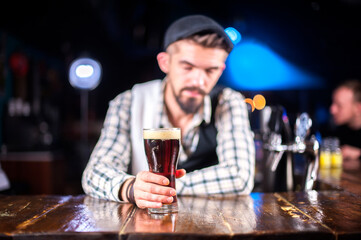 Bartender concocts a cocktail on the taproom