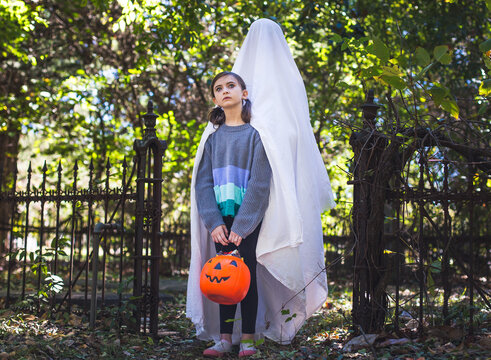 Young girl stands with ghost behind her