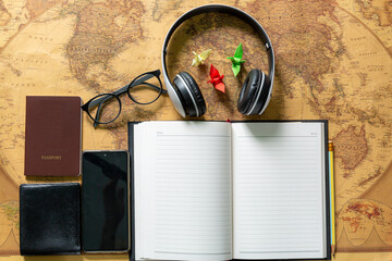 Travel accessories on a wooden desktop,Set for travel on the map background