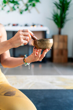 sporty woman touching her yoga vase
