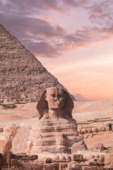 Great Sphinx against the background of the pyramids of the pharaohs Cheops, Khafren, and Mikerin in...