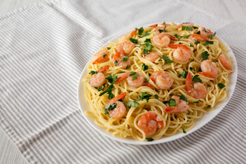 Homemade Shrimp Scampi with Pasta, low angle view. Space for text.