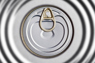 Metal food can. Sealed metal container. Empty copy space round metal lid. Top view conserve...