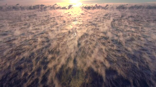 Extremely cold Lake Michigan water steams in even colder subzero air, Wisconsin Winter, aerial view. One would be hard pressed to find better footage to illustrate extreme cold. 