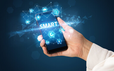 Hand using smartphone with technology concept