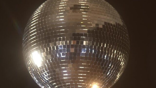 Spinning disco ball with stars and sparkles