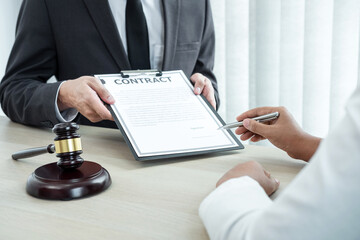 Professional Male lawyer or counselor discussing negotiation legal case with client meeting with document contract in office, law and justice, attorney, lawsuit concept