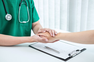 Hand of doctor touching patient reassuring for encouragement and empathy to support while medical...