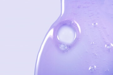 Cream gel transparent cosmetic serum oil sample texture with bubbles background. Shampoo texture.