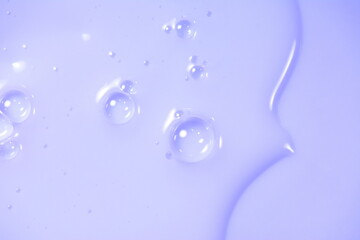 Cream gel transparent cosmetic serum oil sample texture with bubbles background. Shampoo texture.