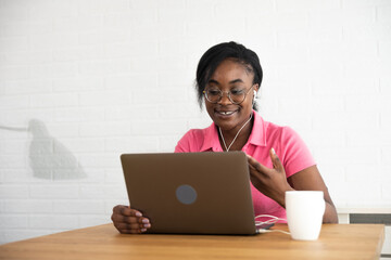Young African American woman blogger and human rights activist research about cyber bullyng and...