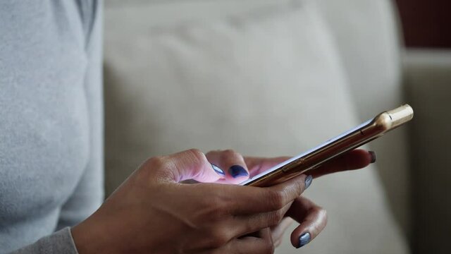 Hand woman using the cell smartphone to send text chat messages mobile to people