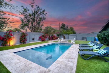 Sunset over a luxury pool  - Powered by Adobe